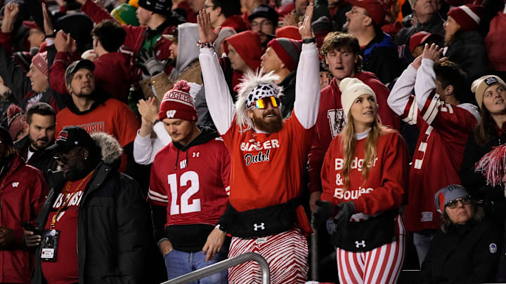 Oct 28, 2023; Madison, Wisconsin, USA; Wisconsin Badgers fans celebrate a touchdown during the second half of the NCAA football game against the Ohio State Buckeyes at Camp Randall Stadium. Ohio State won 24-10.