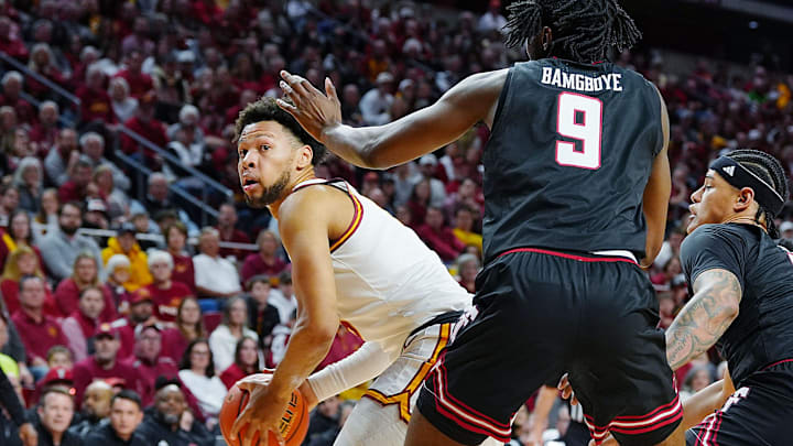 Iowa State Cyclones forward Joshua Jefferson (5) looks for a drive around Texas Tech Red Raiders forward Luke Bamgboye (9) during the first half in the Big-12 conference men’s basketball showdown on Feb. 28, 2026, at Hilton Coliseum in Ames, Iowa.
