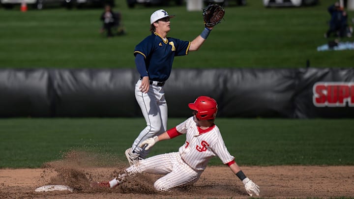 St. John's Pearson Dodds steals second ahead of the throw to Xaverian's Jackson Morse.