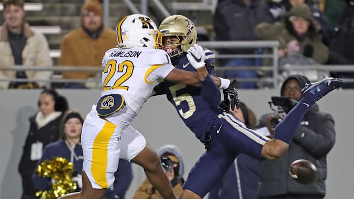 Kent State defensive back Jaire Rawlison (22) interferes on a pass intended for Akron Zips wide receiver Israel Polk (5) during the second half of the Wagon Wheel Rivalry football game at InfoCision Stadium, Nov. 11, 2025, in Akron, Ohio.