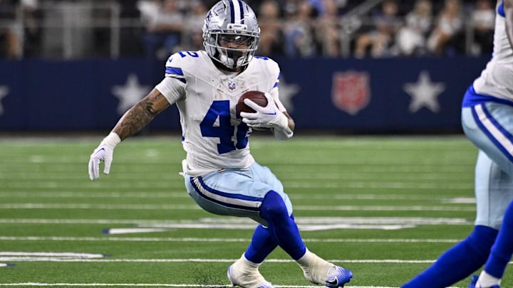 Aug 16, 2025; Arlington, Texas, USA; Dallas Cowboys running back Deuce Vaughn (42) runs with the ball during the game between the Dallas Cowboys and the Baltimore Ravens at AT&T Stadium. Mandatory Credit: Jerome Miron-Imagn Images