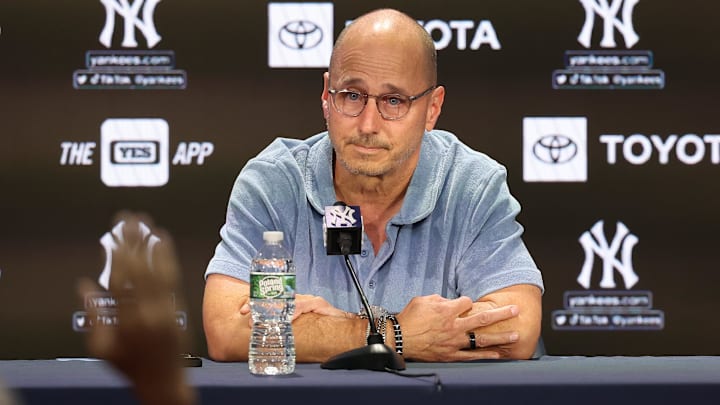 Aug 23, 2023; Bronx, New York, USA; New York Yankees general manager Brian Cashman talks with the media before the game between the Yankees and the Washington Nationals at Yankee Stadium. Mandatory Credit: Vincent Carchietta-Imagn Images