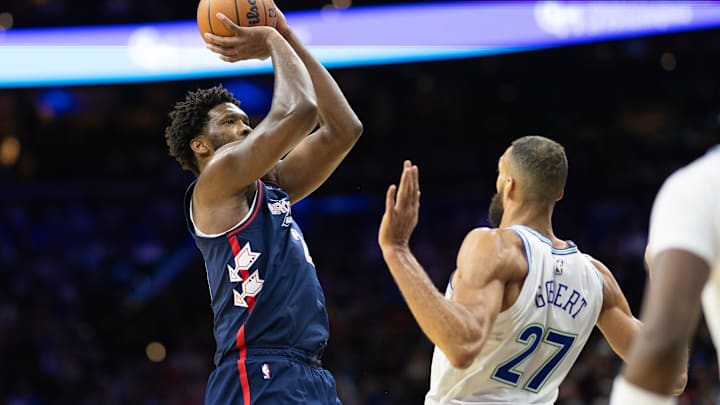 Dec 20, 2023; Philadelphia, Pennsylvania, USA; Philadelphia 76ers center Joel Embiid (21) shoots the ball in front of Minnesota Timberwolves center Rudy Gobert (27) during the third quarter at Wells Fargo Center. Mandatory Credit: Bill Streicher-Imagn Images Dec 20, 2023; Philadelphia, Pennsylvania, USA; Philadelphia 76ers center Joel Embiid (21) shoots the ball in front of Minnesota Timberwolves center Rudy Gobert (27) during the third quarter at Wells Fargo Center. Mandatory Credit: Bill Streicher-Imagn Images