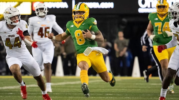 Oregon quarterback Dillon Gabriel carries the ball as the Ducks host Maryland at Autzen Stadium on Saturday, Nov. 9, 2024,