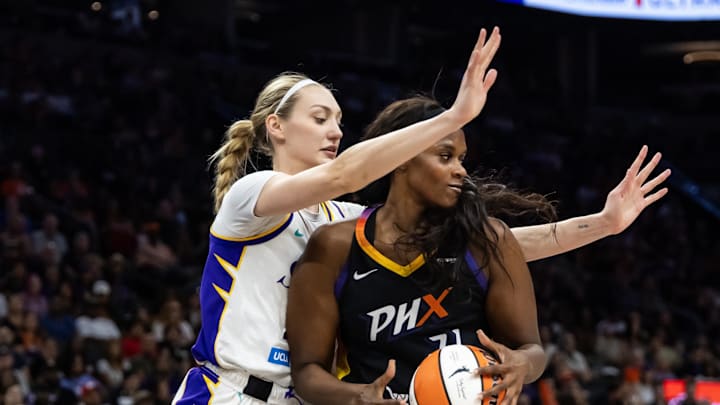 Sep 9, 2025; Phoenix, Arizona, USA; Los Angeles Sparks forward Cameron Brink (22) defends against Phoenix Mercury center Kalani Brown (21) during a WNBA game at PHX Arena. Mandatory Credit: Mark J. Rebilas-Imagn Images