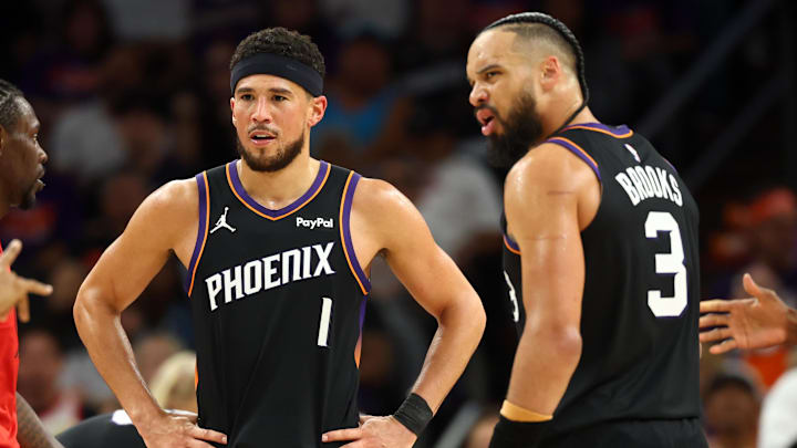 Apr 14, 2026; Phoenix, Arizona, USA; Phoenix Suns guard Devin Booker (1) and forward Dillon Brooks (3) against the Portland Trail Blazers during the play-in rounds of the 2026 NBA Playoffs at Mortgage Matchup Center. Mandatory Credit: Mark J. Rebilas-Imagn Images