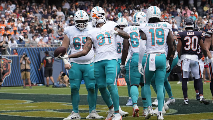 Miami Dolphins running back Ollie Gordon II (31) celebrates his touchdown against the Chicago Bears during the second half at Soldier Field on Sunday.