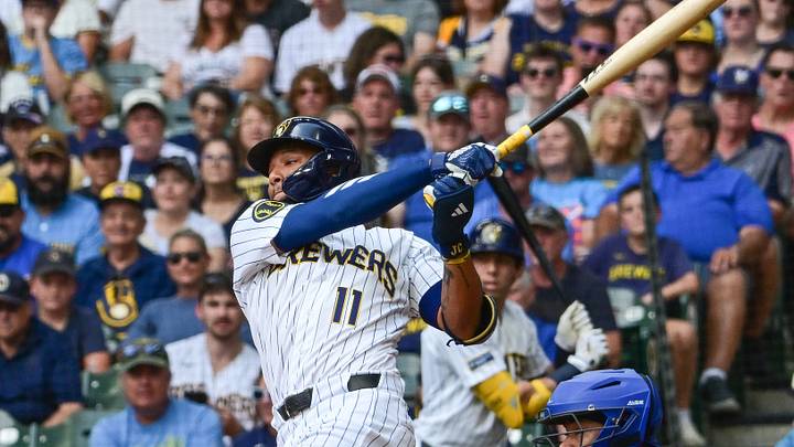 Aug 30, 2026; Milwaukee, Wisconsin, USA;  Milwaukee Brewers left fielder Jackson Chourio (11) drives in a run with a base hit in the first inning against the Texas Rangers at American Family Field.  Mandatory Credit: Benny Sieu-Imagn Images