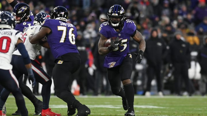 Jan 20, 2024; Baltimore, MD, USA; Baltimore Ravens running back Gus Edwards (35) runs the ball against the Houston Texans during the second quarter of a 2024 AFC divisional round game at M&T Bank Stadium. Mandatory Credit: Tommy Gilligan-USA TODAY Sports. Jan 20, 2024; Baltimore, MD, USA; Baltimore Ravens running back Gus Edwards (35) runs the ball against the Houston Texans during the second quarter of a 2024 AFC divisional round game at M&T Bank Stadium. Mandatory Credit: Tommy Gilligan-USA TODAY Sports.