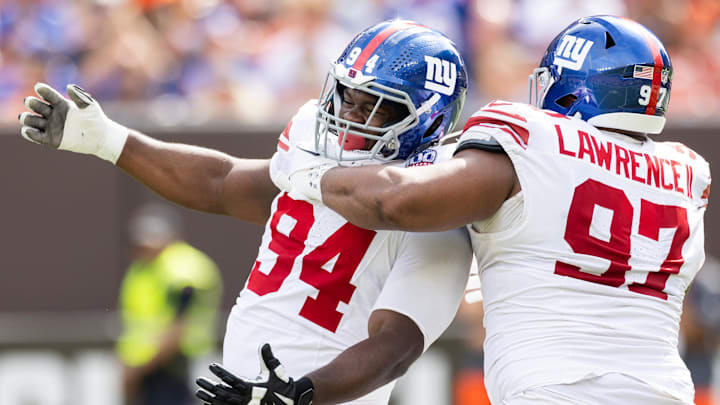Sep 22, 2024; Cleveland, Ohio, USA; New York Giants defensive tackle Dexter Lawrence II (97) congratulates defensive tackle Elijah Chatman (94) on his sack against the Cleveland Browns during the first quarter at Huntington Bank Field.  