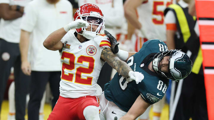 Feb 9, 2025; New Orleans, LA, USA; Kansas City Chiefs cornerback Trent McDuffie (22) and Philadelphia Eagles tight end Dallas Goedert (88) battle for position as they look for the ball in the first quarter in Super Bowl LIX at Ceasars Superdome. Mandatory Credit: Stephen Lew-Imagn Images