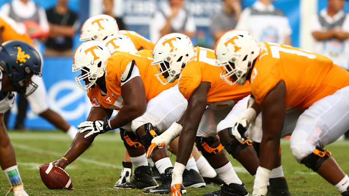 Sep 1, 2018; Charlotte, NC, USA; The Tennessee Volunteers offensive line waits for the snap against the West Virginia Mountaineers at Bank of America Stadium. Mandatory Credit: Jeremy Brevard-Imagn Images
