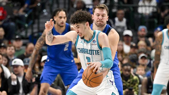 Nov 5, 2023; Dallas, Texas, USA; Dallas Mavericks guard Luka Doncic (77) attempts to knock the ball away from Charlotte Hornets guard LaMelo Ball (1) during the second quarter at the American Airlines Center. Mandatory Credit: Jerome Miron-Imagn Images
