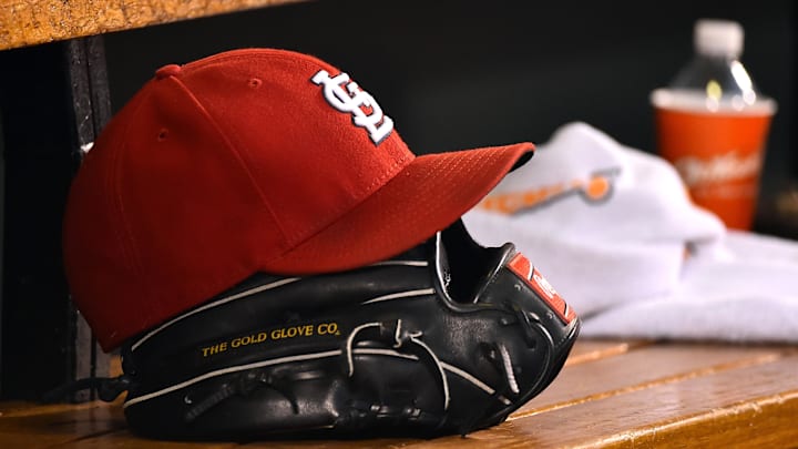 Aug 15, 2015; St. Louis, MO, USA; A detailed view of a baseball glove and St. Louis Cardinals hat in the dugout during the game between the Cardinals and the Miami Marlins at Busch Stadium. Mandatory Credit: Jasen Vinlove-Imagn Images