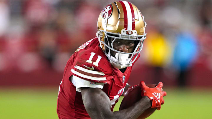 Sep 9, 2024; Santa Clara, California, USA; San Francisco 49ers wide receiver Brandon Aiyuk (11) runs after a catch against the New York Jets during the fourth quarter at Levi's Stadium. Mandatory Credit: Darren Yamashita-Imagn Images
