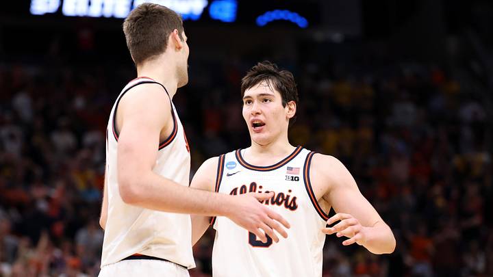 Mar 28, 2026; Houston, TX, USA; Illinois Fighting Illini forward David Mirkovic (0) and center Tomislav Ivisic (13) react in the second half against the Iowa Hawkeyes during an Elite Eight game of the South Regional of the men's 2026 NCAA Tournament at Toyota Center. Mandatory Credit: Troy Taormina-Imagn Images