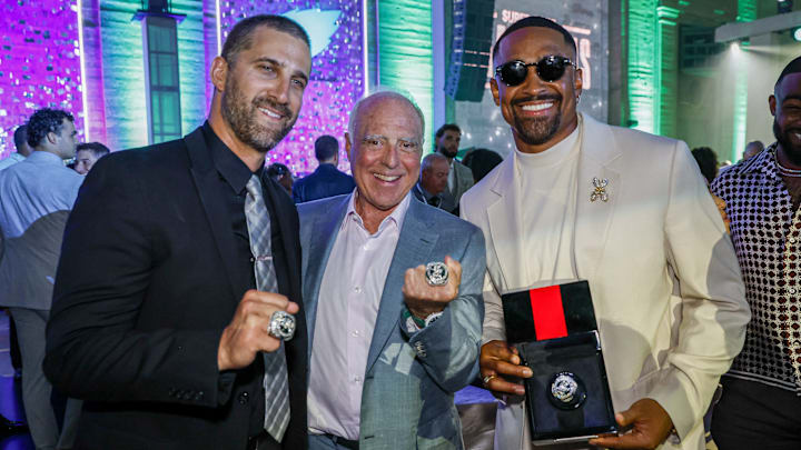 Eagles coach Nick Sirianni, owner Jeffrey Lurie and quarterback Jalen Hurts show off their Super Bowl LIX rings. 