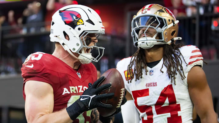 Jan 5, 2025; Glendale, Arizona, USA; Arizona Cardinals tight end Trey McBride (85) celebrates after catching a touchdown pass against San Francisco 49ers linebacker Fred Warner (54) in the first half at State Farm Stadium. Mandatory Credit: Mark J. Rebilas-Imagn Images