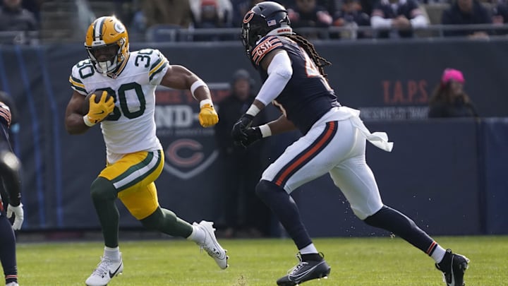Green Bay Packers running back Chris Brooks (30) runs the ball against the Chicago Bears during the first half at Soldier Field. 