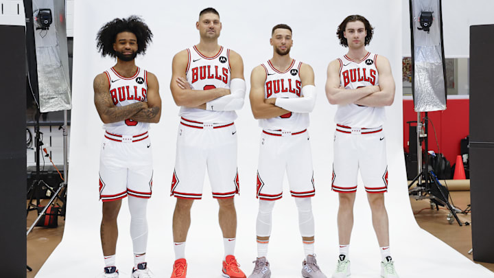 Sep 30, 2024; Chicago, Il, USA; Chicago Bulls guard Coby White (0), center Nikola Vucevic (9), guard Zach LaVine (8) and guard Josh Giddey (3) pose during Chicago Bulls Media Day. Mandatory Credit: Kamil Krzaczynski-Imagn Images