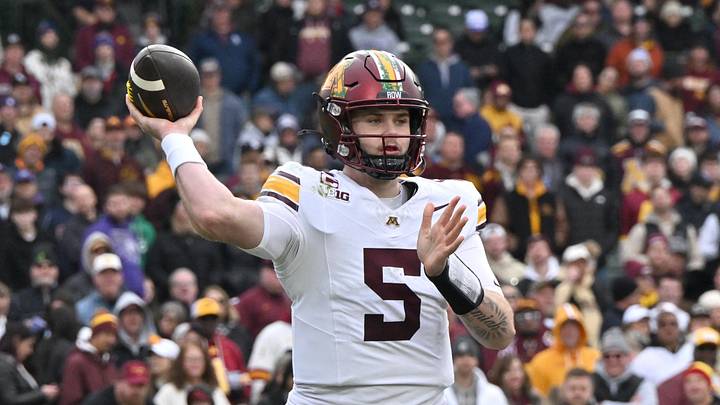 Nov 22, 2025; Chicago, Illinois, USA; Minnesota Golden Gophers quarterback Drake Lindsey (5) throws against the Northwestern Wildcats during the second half at Wrigley Field.