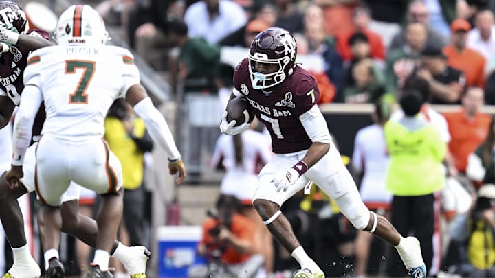 Dec 20, 2025; College Station, TX, USA; Texas A&M Aggies wide receiver KC Concepcion (7) runs the ball against the Miami Hurricanes during the second half at Kyle Field. Mandatory Credit: Maria Lysaker-Imagn Images