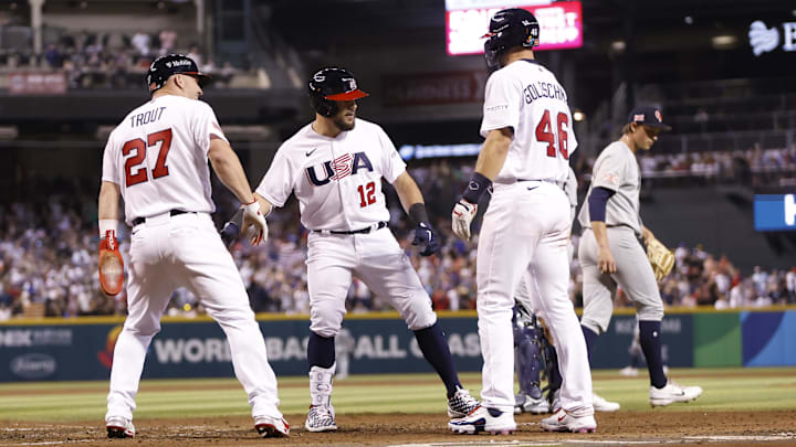 Mar 11, 2023; Phoenix, Arizona, USA; Team USA designated hitter Kyle Schwarber (12) high fives center fielder Mike Trout (27) and first baseman Paul Goldschmidt (46) after hitting a three run home run during the fourth inning against Team Great Britain at Chase Field. Mandatory Credit: Chris Coduto-Imagn Images Mar 11, 2023; Phoenix, Arizona, USA; Team USA designated hitter Kyle Schwarber (12) high fives center fielder Mike Trout (27) and first baseman Paul Goldschmidt (46) after hitting a three run home run during the fourth inning against Team Great Britain at Chase Field. Mandatory Credit: Chris Coduto-Imagn Images