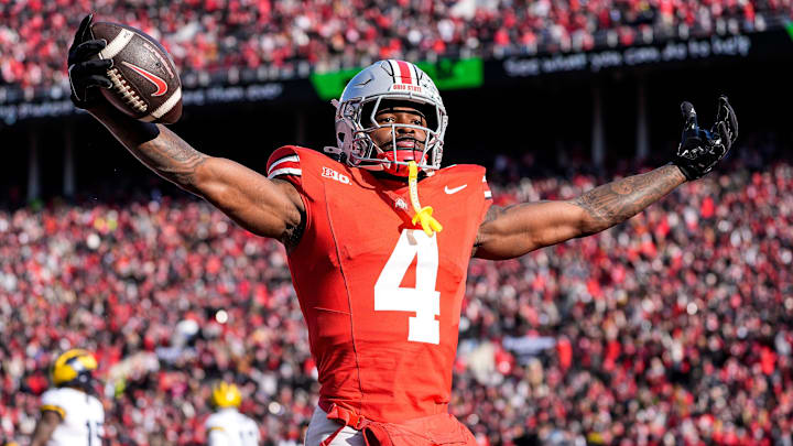 Ohio State wide receiver Jeremiah Smith (4) celebrates a touchdown against Michigan during the first half at Ohio Stadium in Columbus, Ohio on Saturday, Nov. 30, 2024.