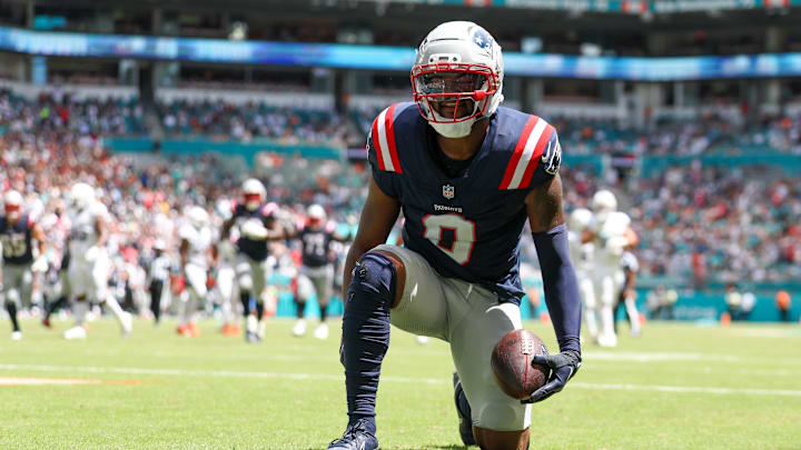 Sep 14, 2025; Miami Gardens, Florida, USA; New England Patriots wide receiver Kayshon Boutte (9) races after scoring a touchdown against the Miami Dolphins in the first quarter  at Hard Rock Stadium. Mandatory Credit: Nathan Ray Seebeck-Imagn Images