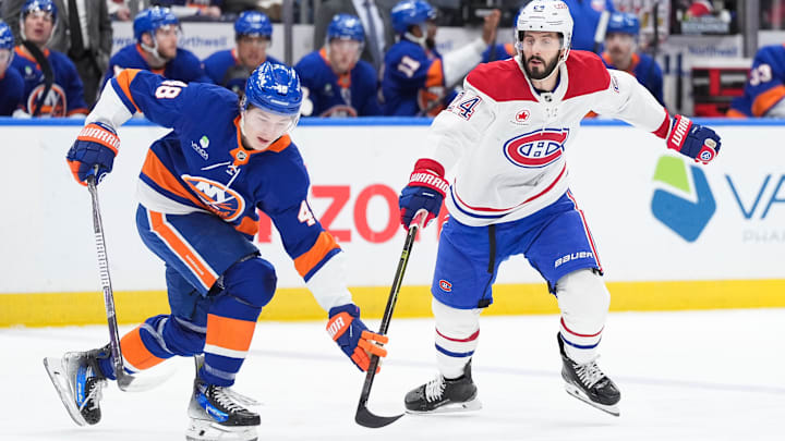 Apr 12, 2026; Elmont, New York, USA; New York Islanders defenseman Matthew Schaefer (48) keeps the puck away from Montréal Canadiens center Phillip Danault (24) in the first period at UBS Arena. Mandatory Credit: Alexander Wohl-Imagn Images Apr 12, 2026; Elmont, New York, USA; New York Islanders defenseman Matthew Schaefer (48) keeps the puck away from Montréal Canadiens center Phillip Danault (24) in the first period at UBS Arena. Mandatory Credit: Alexander Wohl-Imagn Images