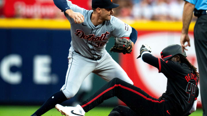 Detroit Tigers shortstop Ryan Kreidler (32) turns a double play as Cincinnati Reds shortstop Elly De La Cruz (44) slides into second in the fourth inning of the MLB game between the Cincinnati Reds and the Detroit Tigers at Great American Ball Park in Cincinnati on Friday, July 5, 2024.
