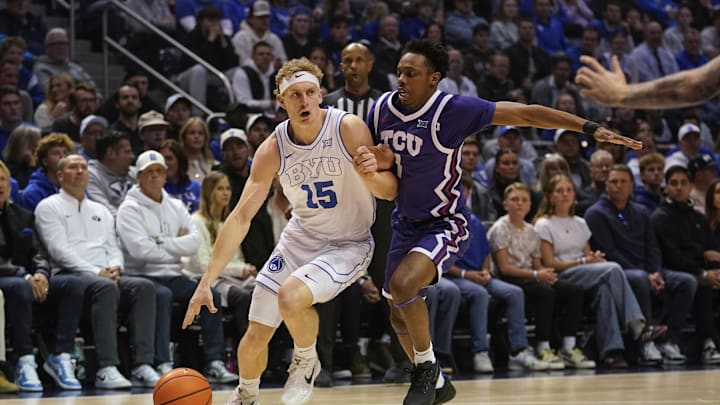 Jan 14, 2026; Provo, Utah, USA; BYU Cougars guard Richie Saunders (15) controls the ball against the TCU Horned Frogs during the first half  at Marriott Center. Mandatory Credit: Aaron Baker-Imagn Images
