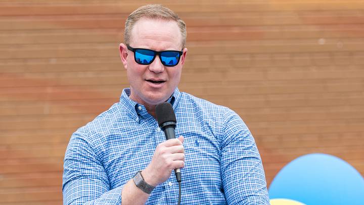 Milwaukee Brewers general manager Matt Arnold participates in a panel discussion during a tailgate-themed celebration marking the completion of “Mr. Baseball,” a new 80-by-100-foot mural by artist Mauricio Ramirez depicting longtime Milwaukee Brewers broadcaster Bob Uecker in Milwaukee, Wisconsin on June 30, 2026.