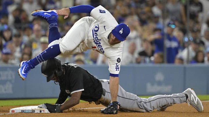 Jul 2, 2025; Los Angeles, California, USA; Los Angeles Dodgers third baseman Max Muncy (13) is injured as he flips over Chicago White Sox right fielder Michael A. Taylor (21) after tagging him out on an attempted steal in the fifth inning at Dodger Stadium. Mandatory Credit: Jayne Kamin-Oncea-Imagn Images Jul 2, 2025; Los Angeles, California, USA; Los Angeles Dodgers third baseman Max Muncy (13) is injured as he flips over Chicago White Sox right fielder Michael A. Taylor (21) after tagging him out on an attempted steal in the fifth inning at Dodger Stadium. Mandatory Credit: Jayne Kamin-Oncea-Imagn Images