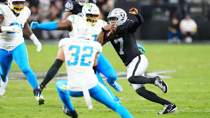 Sep 15, 2025; Paradise, Nevada, USA;  Las Vegas Raiders quarterback Geno Smith (7) rushes the ball during the second quarter against the Los Angeles Chargers at Allegiant Stadium. Mandatory Credit: Stephen R. Sylvanie-Imagn Images