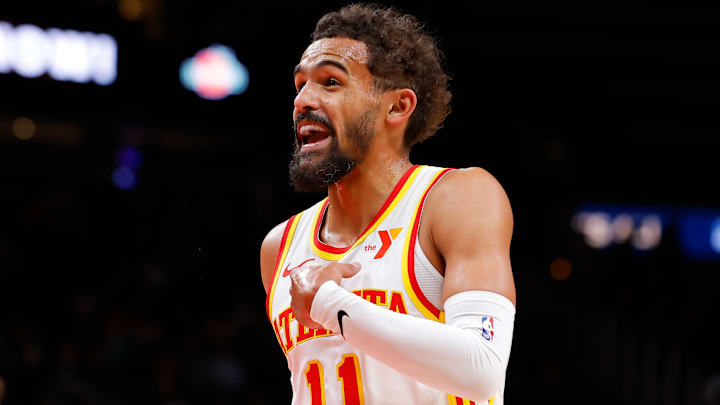 Trae Young #11 of the Atlanta Hawks reacts against the Boston Celtics.