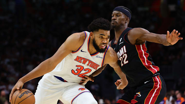 Oct 30, 2024; Miami, Florida, USA; New York Knicks center Karl-Anthony Towns (32) drives to the basketball against Miami Heat forward Jimmy Butler (22) during the fourth quarter at Kaseya Center. Mandatory Credit: Sam Navarro-Imagn Images