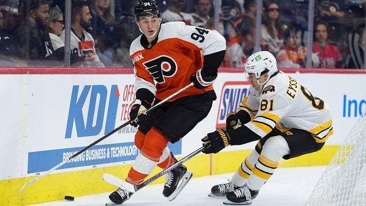Sep 24, 2026; Philadelphia, Pennsylvania, USA; Philadelphia Flyers right wing Porter Martone (94) and Boston Bruins center Michael Eyssimont (81) battle for the puck in the second period at Xfinity Mobile Arena. 