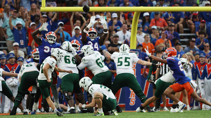 South Florida Bulls place kicker Nico Gramatica (7) kicks a field goal against the Florida Gators during the second half at Ben Hill Griffin Stadium.