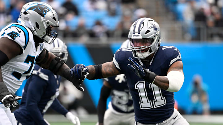 Dec 15, 2024; Charlotte, North Carolina, USA;  Dallas Cowboys linebacker Micah Parsons (11) rushes as Carolina Panthers offensive tackle Taylor Moton (72) defends in the first quarter at Bank of America Stadium. Mandatory Credit: Bob Donnan-Imagn Images