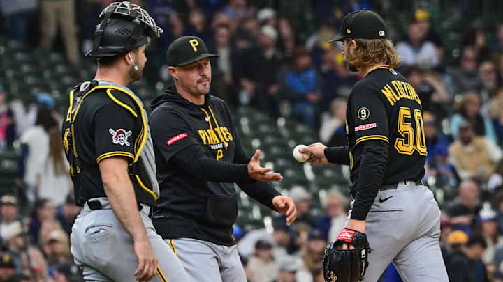 Apr 26, 2026; Milwaukee, Wisconsin, USA; Pittsburgh Pirates starting pitcher Carmen Mlodzinski (50) hands the ball to manager Don Kelly during a pitching change in the fourth inning against the Milwaukee Brewers at American Family Field. Mandatory Credit: Benny Sieu-Imagn Images