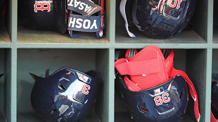 Jul 21, 2025; Philadelphia, Pennsylvania, USA; Boston Red Sox batting helmets in the dugout against the Philadelphia Phillies at Citizens Bank Park. Mandatory Credit: Eric Hartline-Imagn Images