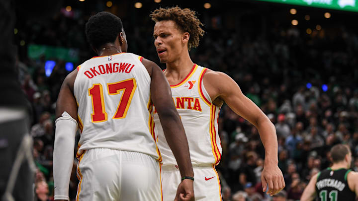 Onyeka Onkonwu #17 and Dyson Daniels #5 of the Atlanta Hawks celebrate against the Boston Celtics.