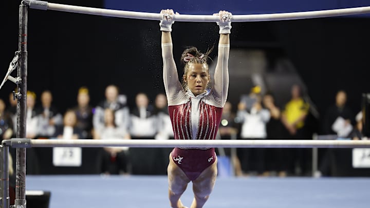 Mar 30, 2023; Norman, OK, USA; University of Alabama gymnast Cam Machado performs bars exercise during the 2023 NCAA women's gymnastics regional at Lloyd Noble Center. Mandatory Mar 30, 2023; Norman, OK, USA; University of Alabama gymnast Cam Machado performs bars exercise during the 2023 NCAA women's gymnastics regional at Lloyd Noble Center. Mandatory