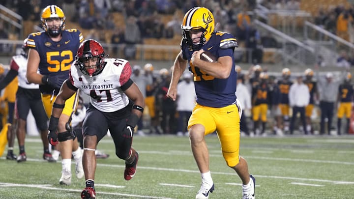 Fernando Mendoza dashes toward the end zone.