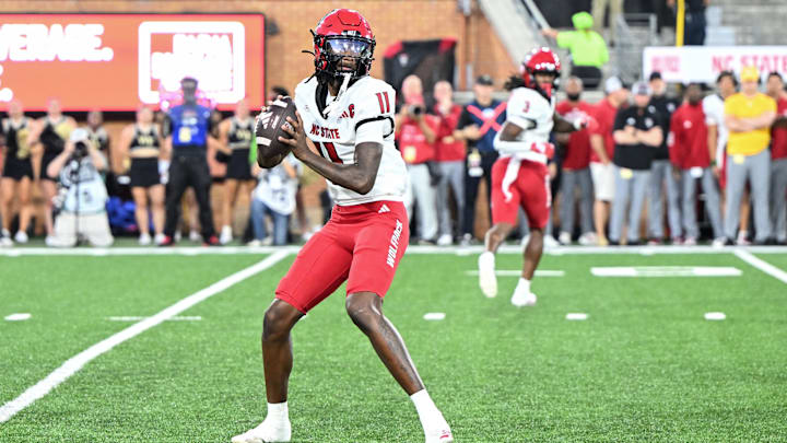 Sep 11, 2025; Winston-Salem, North Carolina, USA;  North Carolina State Wolfpack quarterback CJ Bailey (11) throws a pass in first half against Wake Forest Demon Deacons at Allegacy Federal Credit Union Stadium. Mandatory Credit: Luke Jamroz-Imagn Images