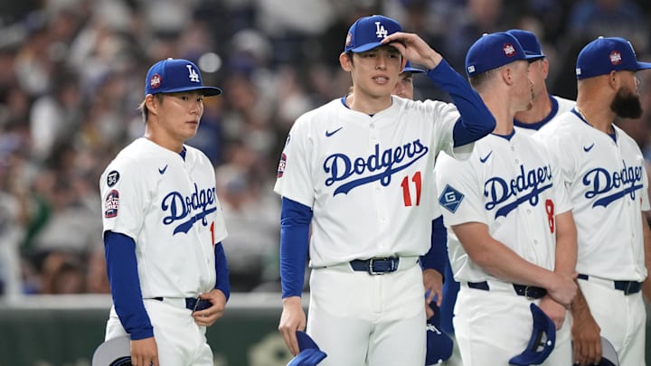 Mar 16, 2025; Bunkyo, Tokyo, Japan; Los Angeles Dodgers pitcher Yoshinobu Yamamoto (left) and pitcher Roki Sasaki (11) stand on the field before the game against the Hanshin Tigers at Tokyo Dome. Mandatory Credit: Darren Yamashita-Imagn Images Mar 16, 2025; Bunkyo, Tokyo, Japan; Los Angeles Dodgers pitcher Yoshinobu Yamamoto (left) and pitcher Roki Sasaki (11) stand on the field before the game against the Hanshin Tigers at Tokyo Dome. Mandatory Credit: Darren Yamashita-Imagn Images