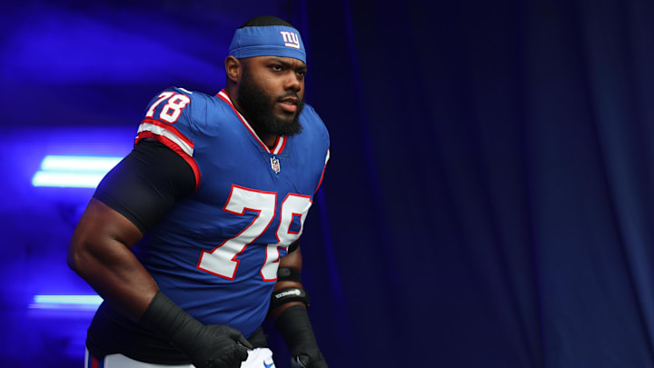 Dec 14, 2025; East Rutherford, New Jersey, USA;  New York Giants offensive tackle Andrew Thomas (78) enters the field prior to the first quarter against the Washington Commanders at MetLife Stadium. Mandatory Credit: Vincent Carchietta-Imagn Images