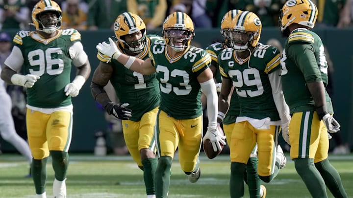 Green Bay Packers safety Evan Williams (33) celebrates his interception during the second quarter of their game against the Detroit Lions Sunday. He's one of 35 Ducks on NFL rosters.