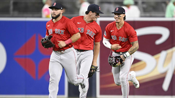 Aug 8, 2025; San Diego, California, USA; Boston Red Sox right fielder Wilyer Abreu (52), left, Roman Anthony (19), center, and Jarren Duran (16) celebrate after the Red Sox beat the San Diego Padres at Petco Park. Mandatory Credit: Denis Poroy-Imagn Images